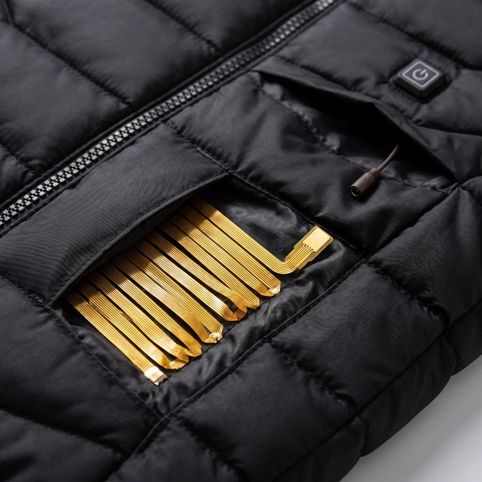 A close-up of the jacket's built-in electric heating elements, threaded through the quilted lining